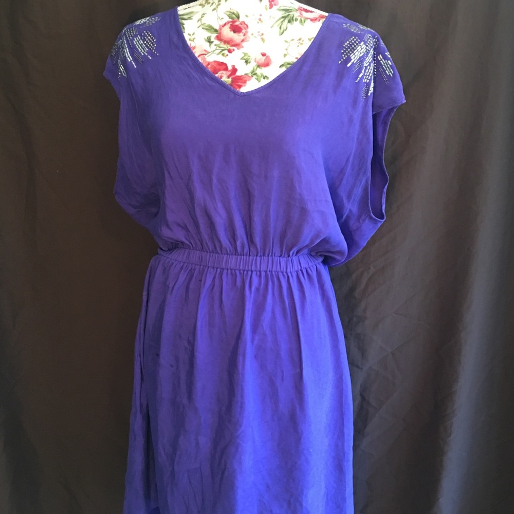 Purple dress with embellishments on shoulders
